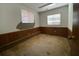 Bedroom with carpet and wood paneling with two windows at 411 Navaho Cir, Summerville, SC 29483