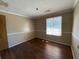 Empty bedroom with hardwood floors and a window at 411 Navaho Cir, Summerville, SC 29483