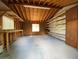 Unfinished room with windows, exposed ceiling, workbench, and storage shelves at 411 Navaho Cir, Summerville, SC 29483