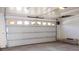 Garage features a modern white garage door and a light-colored floor at 411 Navaho Cir, Summerville, SC 29483