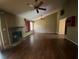 Inviting living room featuring hardwood floors, a fireplace, and a ceiling fan at 411 Navaho Cir, Summerville, SC 29483