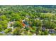 Extensive aerial shot of a neighborhood, highlighting trees, landscaping, and nearby golf course at 4407 Wild Thicket Ln, North Charleston, SC 29420