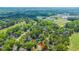 Wide aerial shot of the neighborhood showing a home near schools, parks, and a golf course at 4407 Wild Thicket Ln, North Charleston, SC 29420