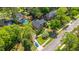 Overhead shot of brick home showing the roof and the landscaped yard with a blue sports car at 4407 Wild Thicket Ln, North Charleston, SC 29420