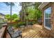 Wooden back deck with chairs and table near a brick house at 4407 Wild Thicket Ln, North Charleston, SC 29420