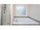 Bathroom featuring a luxurious soaking tub and separate glass-enclosed shower at 4407 Wild Thicket Ln, North Charleston, SC 29420