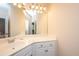 Bright bathroom featuring vanity with white countertop and cabinet storage at 4407 Wild Thicket Ln, North Charleston, SC 29420