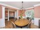 Open-concept dining room with table, chairs, and living space at 4407 Wild Thicket Ln, North Charleston, SC 29420