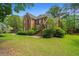 Two-story brick home with a well-maintained lawn and inviting front steps at 4407 Wild Thicket Ln, North Charleston, SC 29420