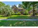 Charming two-story brick home with manicured front yard and mature landscaping at 4407 Wild Thicket Ln, North Charleston, SC 29420