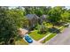 Aerial view of a brick home with a circular driveway and lush landscaping at 4407 Wild Thicket Ln, North Charleston, SC 29420