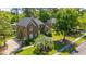 Beautiful brick two-story home with well-manicured lawn and mature trees at 4407 Wild Thicket Ln, North Charleston, SC 29420