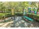 Outdoor fitness area featuring multiple exercise stations and playground in a lush, green community at 4407 Wild Thicket Ln, North Charleston, SC 29420