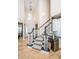 Grand foyer with high ceilings, a staircase, and a built-in wine fridge, highlighting the home's elegance at 4407 Wild Thicket Ln, North Charleston, SC 29420