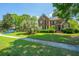 Attractive two-story brick home with manicured lawn and vibrant blue sports car at 4407 Wild Thicket Ln, North Charleston, SC 29420