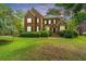 Two-story brick home with manicured landscaping and a welcoming front entrance at 4407 Wild Thicket Ln, North Charleston, SC 29420