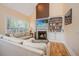 Comfortable living room featuring a fireplace, built-in bookshelves, and hardwood floors at 4407 Wild Thicket Ln, North Charleston, SC 29420