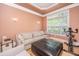 Relaxing living room with large window, comfortable couch, and workout bike at 4407 Wild Thicket Ln, North Charleston, SC 29420