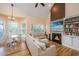 Cozy living room featuring a fireplace, built-in bookshelves, and hardwood flooring at 4407 Wild Thicket Ln, North Charleston, SC 29420