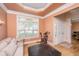 Inviting living room with tray ceiling, hardwood floors, neutral furnishings, and bright natural light at 4407 Wild Thicket Ln, North Charleston, SC 29420