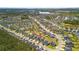 Sprawling aerial view of a vibrant residential area with neatly arranged homes, winding streets, and lush greenery at 476 Foxbank Plantation Blvd, Moncks Corner, SC 29461