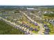 Sprawling aerial view of a vibrant residential area with neatly arranged homes, winding streets, and lush greenery at 476 Foxbank Plantation Blvd, Moncks Corner, SC 29461