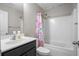 Bright bathroom with a shower-tub combination and a modern vanity with a gray cabinet at 476 Foxbank Plantation Blvd, Moncks Corner, SC 29461