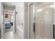 Modern bathroom with a shower, soaker tub, and doorway to a bedroom with natural light at 476 Foxbank Plantation Blvd, Moncks Corner, SC 29461