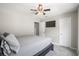 Comfortable bedroom features a ceiling fan, neutral paint, a television and plush carpeting at 476 Foxbank Plantation Blvd, Moncks Corner, SC 29461