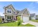 Charming two-story home with a well-manicured lawn and an attached garage in a friendly neighborhood at 476 Foxbank Plantation Blvd, Moncks Corner, SC 29461