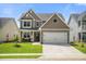 Beautiful two-story home with well-kept lawn, attached garage, and appealing curb appeal at 476 Foxbank Plantation Blvd, Moncks Corner, SC 29461