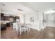 Kitchen with island seating open to breakfast area, hardwood floors and lots of light at 476 Foxbank Plantation Blvd, Moncks Corner, SC 29461