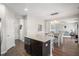 Modern kitchen with granite island seating, stainless appliances and dark cabinets at 476 Foxbank Plantation Blvd, Moncks Corner, SC 29461