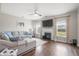 Comfortable living room features hardwood floors, fireplace, and lots of natural light at 476 Foxbank Plantation Blvd, Moncks Corner, SC 29461