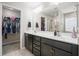Double sink vanity with a walk-in closet and glass door shower in the primary bathroom at 476 Foxbank Plantation Blvd, Moncks Corner, SC 29461