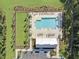Aerial view of community pool, pool house, lounge chairs, and landscaping at 500 W Respite Ln, Summerville, SC 29483