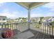 Charming balcony with wicker furniture and a view of the neighborhood at 500 W Respite Ln, Summerville, SC 29483