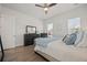 Bright bedroom with a ceiling fan, wood flooring, and a large dresser for ample storage at 500 W Respite Ln, Summerville, SC 29483