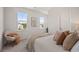 Bright bedroom featuring large windows, natural light, and a comfortable chair, perfect for relaxation at 500 W Respite Ln, Summerville, SC 29483