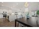 Bright dining area with a chandelier, modern decor, and an open kitchen view at 500 W Respite Ln, Summerville, SC 29483