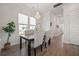 Elegant dining room with a chandelier, large windows, and stylish furnishings at 500 W Respite Ln, Summerville, SC 29483