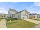 Home exterior with a screened porch, a garage, and manicured landscaping at 500 W Respite Ln, Summerville, SC 29483