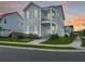 Charming two-story home boasting a beautiful sunset and manicured lawn at 500 W Respite Ln, Summerville, SC 29483