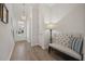 Stylish foyer with a tufted bench, decorative lighting, and wood-look floors at 500 W Respite Ln, Summerville, SC 29483