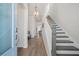 Bright foyer showcasing wood floors, a staircase, and elegant lighting fixtures at 500 W Respite Ln, Summerville, SC 29483