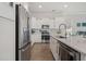 Contemporary kitchen with a stainless steel refrigerator, range, and island sink at 500 W Respite Ln, Summerville, SC 29483