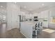 Modern kitchen featuring white cabinets, a kitchen island, and stainless steel appliances at 500 W Respite Ln, Summerville, SC 29483