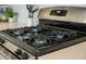 Close-up of a stainless-steel gas stovetop, showcasing the four burners and sleek design at 500 W Respite Ln, Summerville, SC 29483