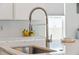 Close-up of the kitchen faucet and countertop, highlighting the sink and modern design at 500 W Respite Ln, Summerville, SC 29483