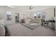 Bright living room with carpet, contemporary furnishings, and multiple windows for natural light at 500 W Respite Ln, Summerville, SC 29483